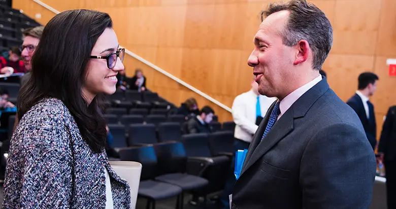 Rutgers Business School student speaking with Rutgers alumnus Gary Chropuvka.