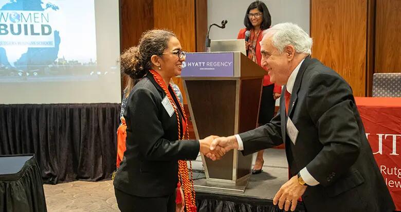 Rutgers Business School Senior Associate Dean Martin Markowitz presented medals to the graduating senior members of Women BUILD.