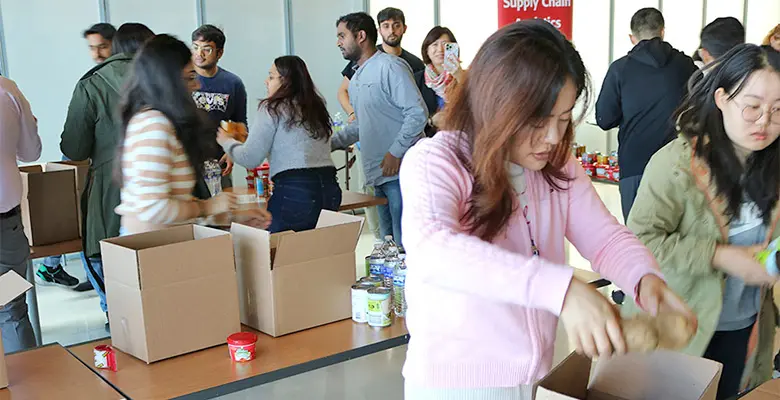 Teams filling food boxes.