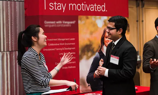 Student talking with recruiter