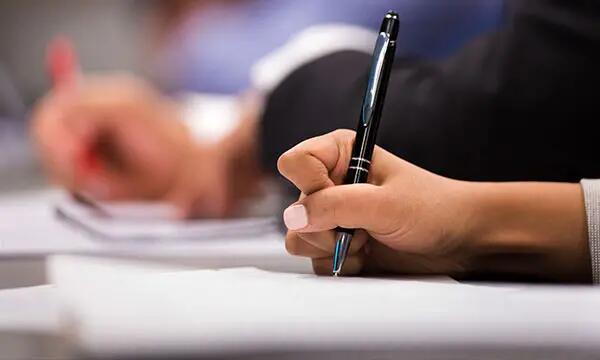 Student writes in class