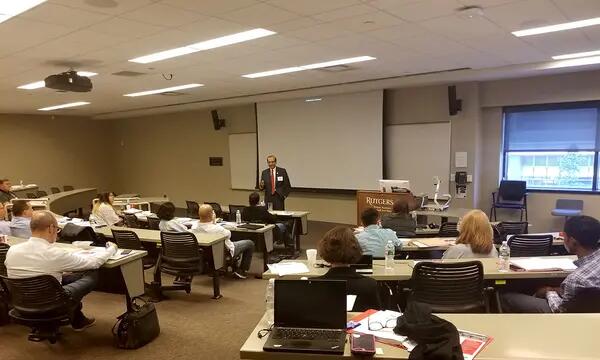 Professor Alok Baveja in class with students of the program