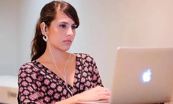 Female student typing on computer