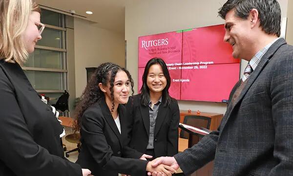 students speaking with jeffrey hermann