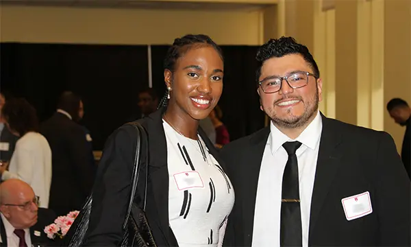 female and male mba students posing for picture