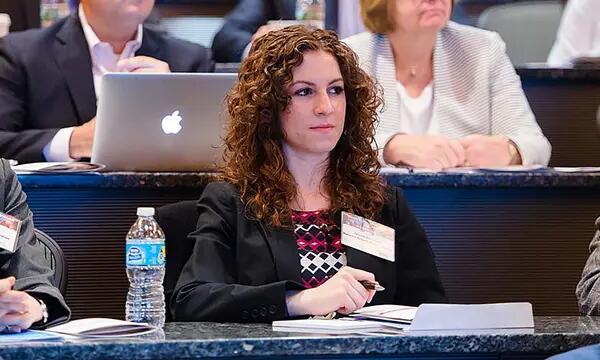 Participants of the certificate program watching a presentation