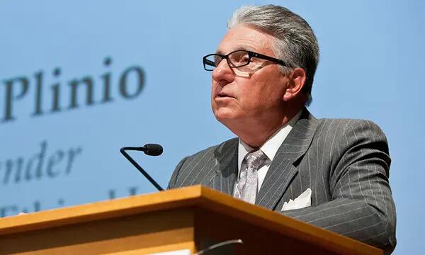 Alex Plinio speaks at an IEL event