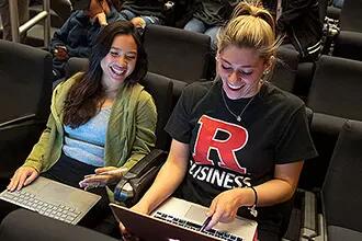 students looking at the computer