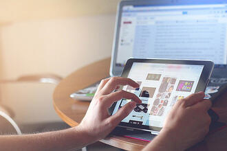 Close-up of hands on a tablet