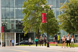 students walking away from 100 rock