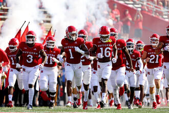 rutgers football players entering the field