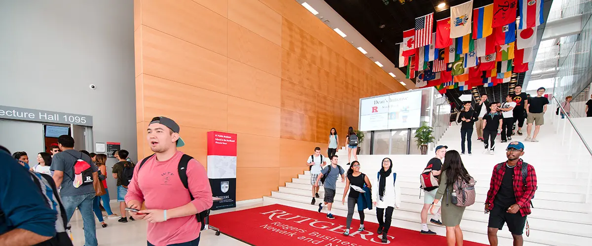 Students walking down the stairs of the front entrance at 100 Rock
