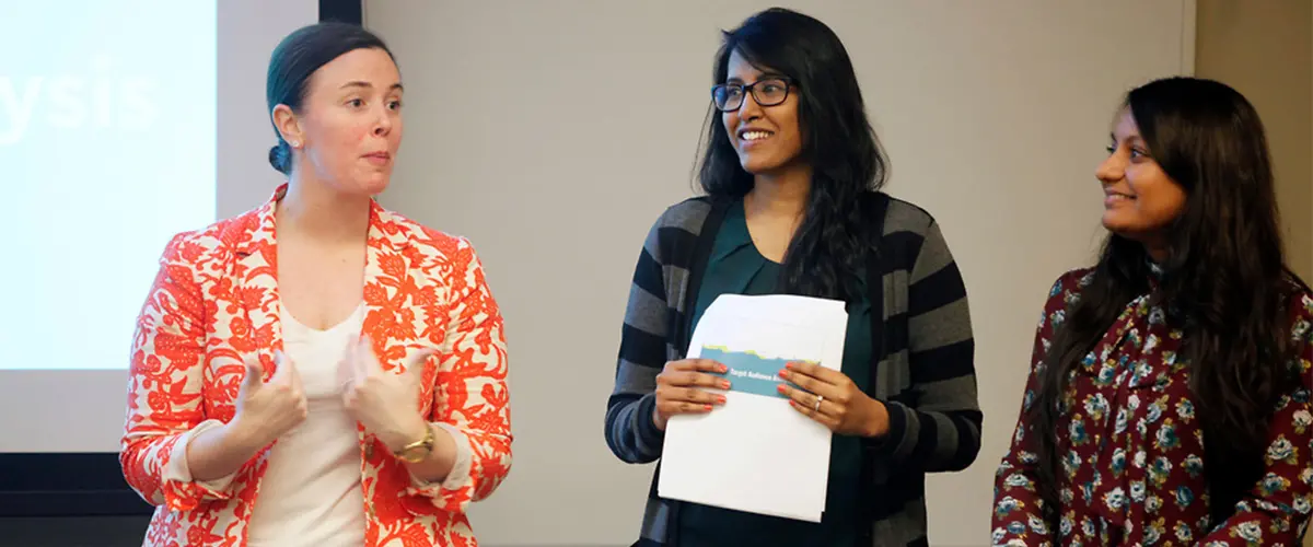 Rutgers graduate students presenting in class.