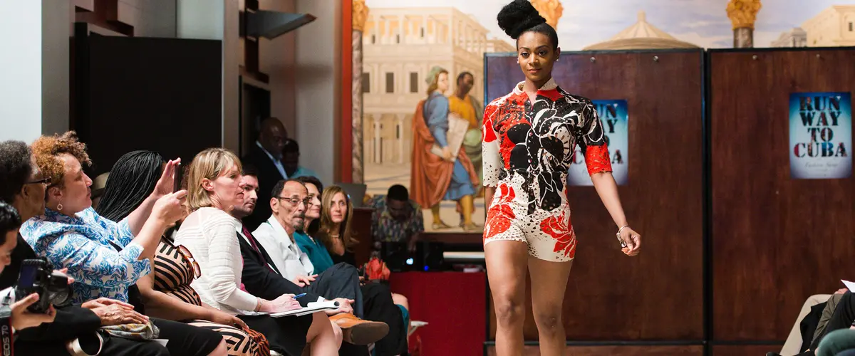 Model on runway at Rutgers event.