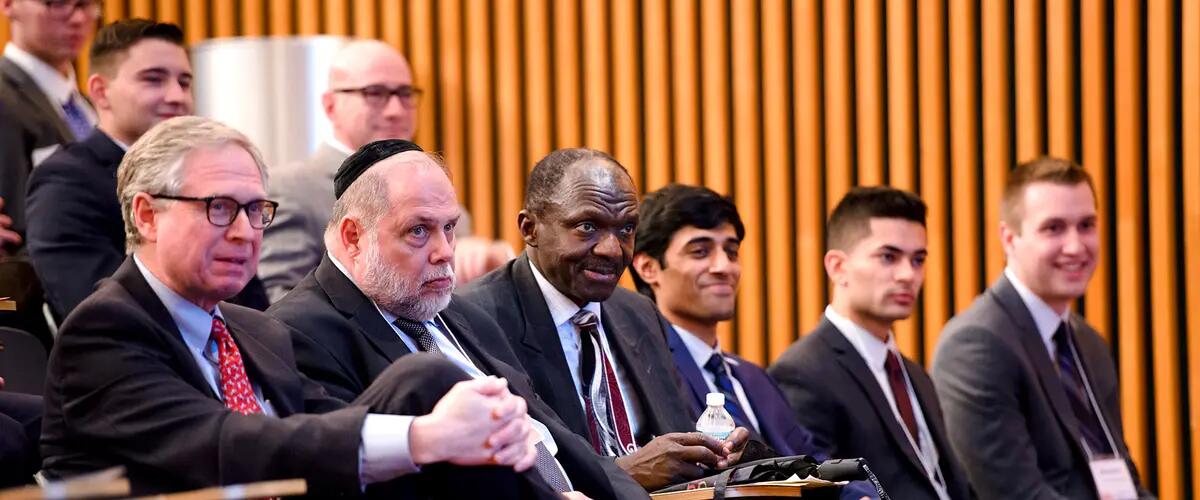 Various members of the Rutgers Financial Instituitions Center and guests seated for a conference