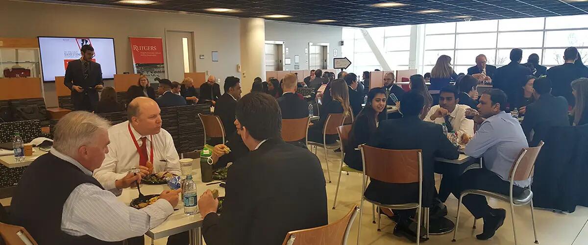 Members of the center together eating lunch at a center event