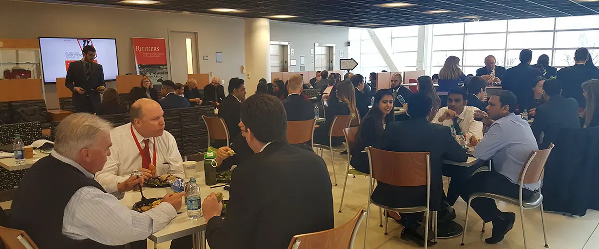 Members of the center together eating lunch at a center event