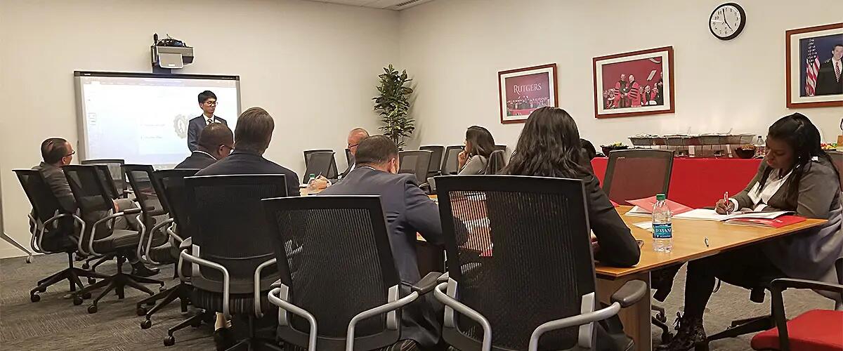 Corporate sponsors sitting in a board room meeting