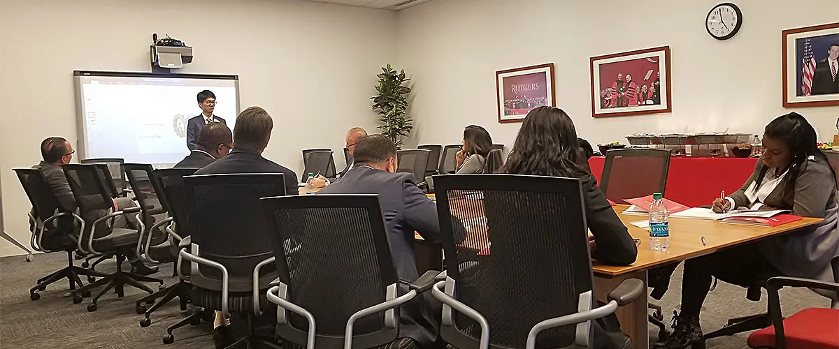Corporate sponsors sitting in a board room meeting