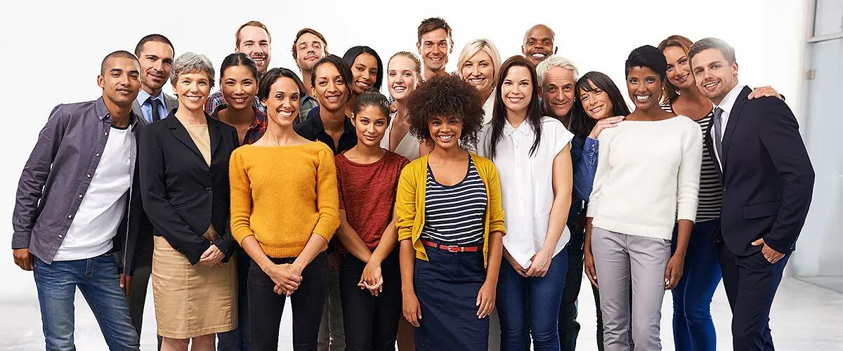 A group of people from various backgrounds posing together for a photo