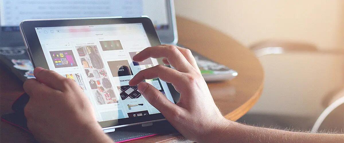 Close-up of hands on a tablet