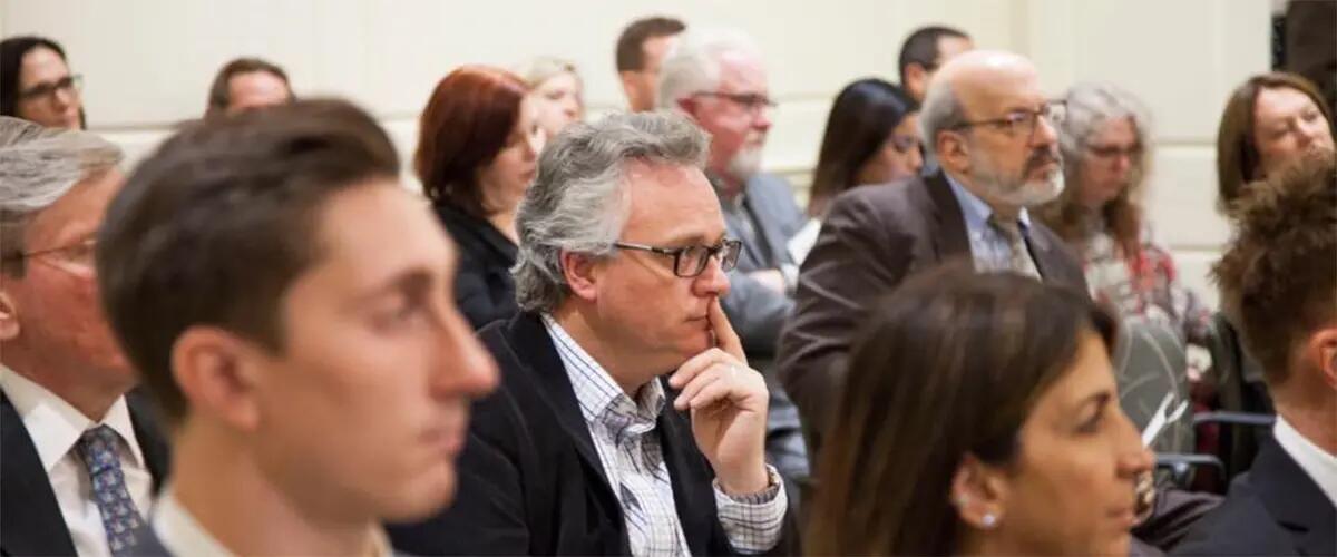 Michael Barnett and a crowd of people pictured at an ethical leadership conference