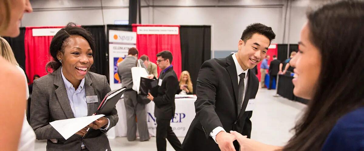 students speaking with employers