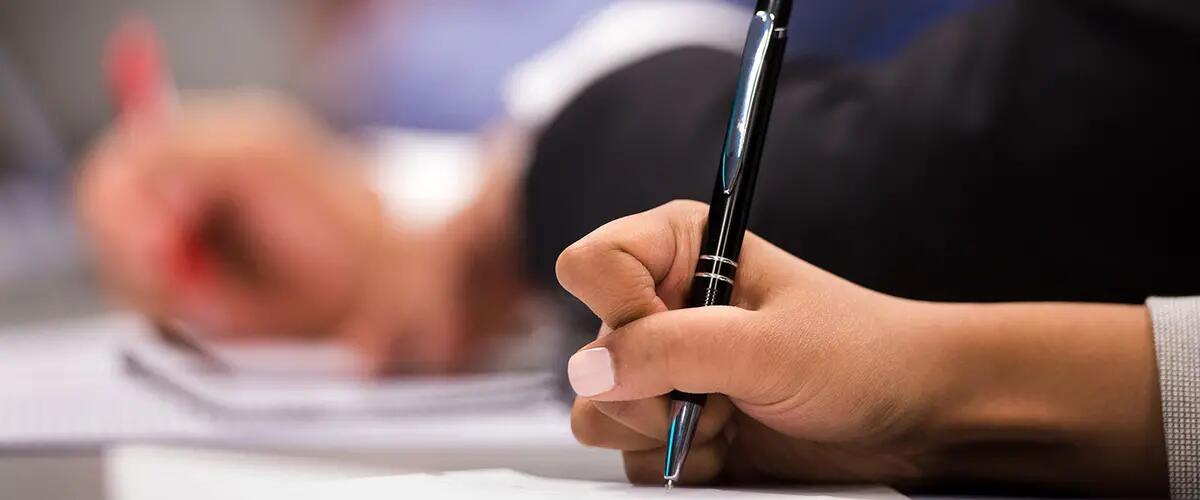 A closeup image of paperwork being filled out