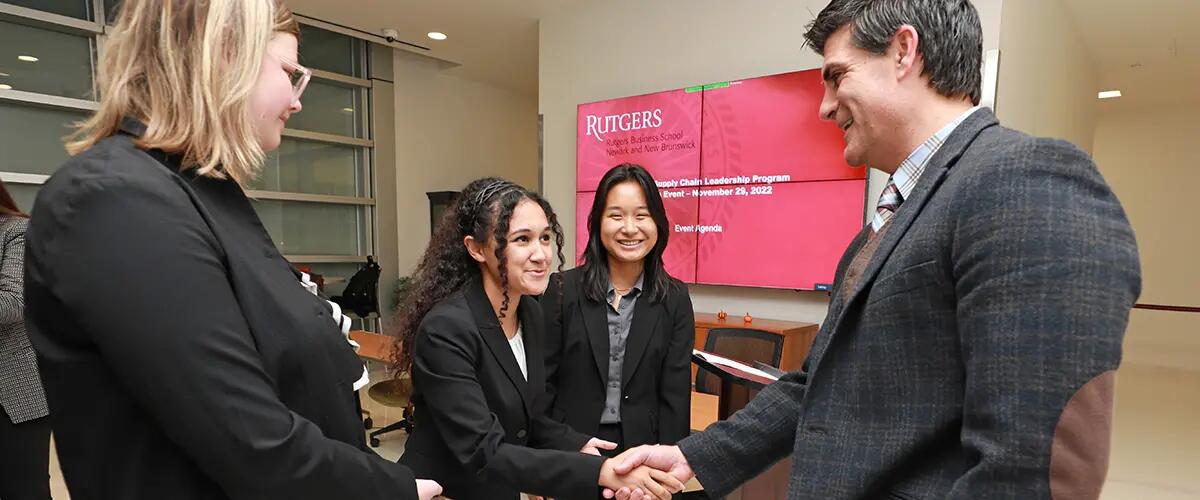 students speaking with jeffrey hermann