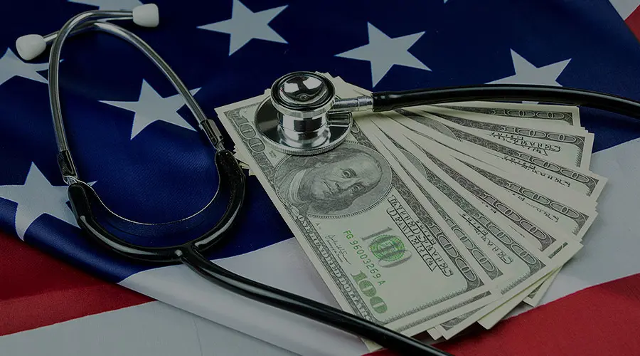 A folded U.S. flag with a doctor's stethoscope.