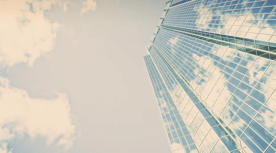 view of skyscraper from ground looking up